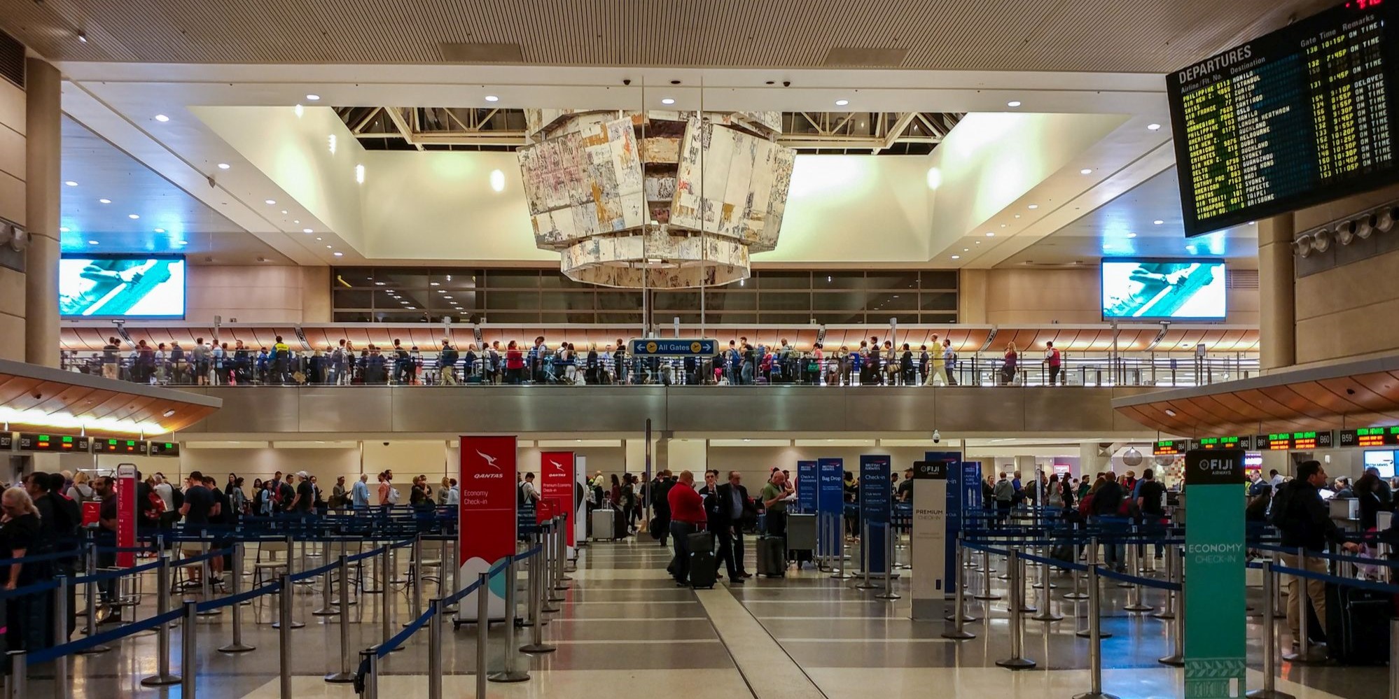 Old school departure board in the Tom Bradley international terminal at Los Angeles airport.